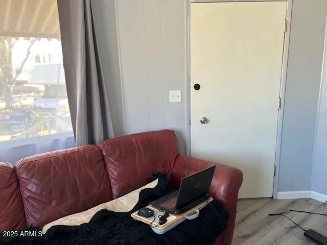 a living room with furniture and a window