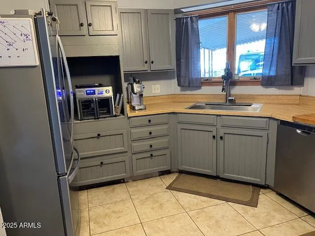 a kitchen with cabinets and window