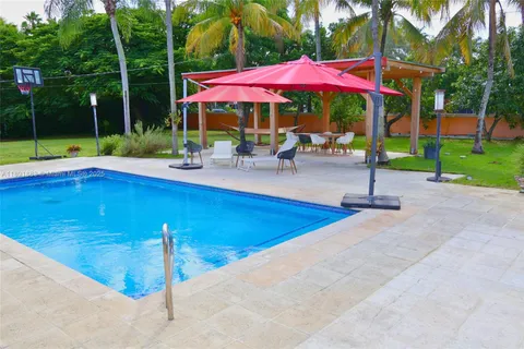 a view of a livingroom with furniture and a flat screen tv