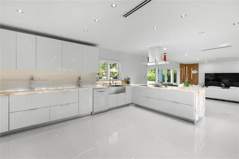 a spacious bathroom with a sink and a mirror