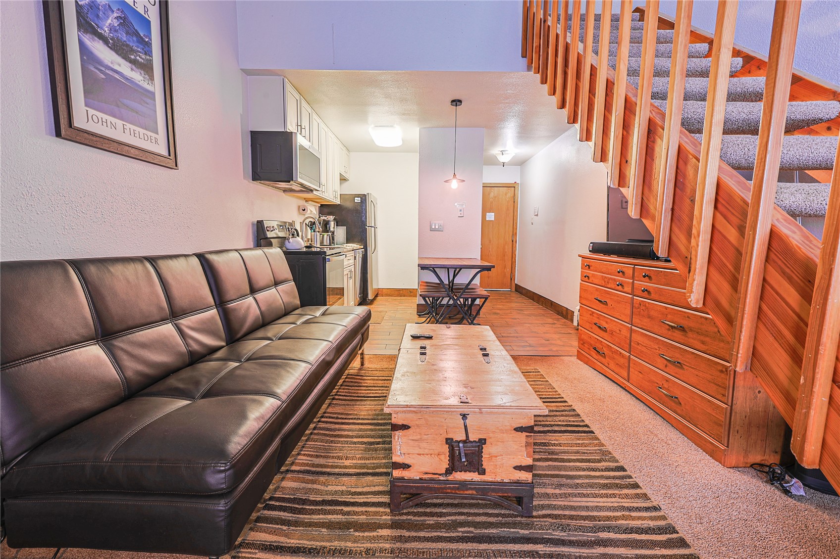 214 Ten Mile Circle, Unit R310 Copper Mountain, CO 80443 - Photo 6 of 15 a large living room with stainless steel appliances