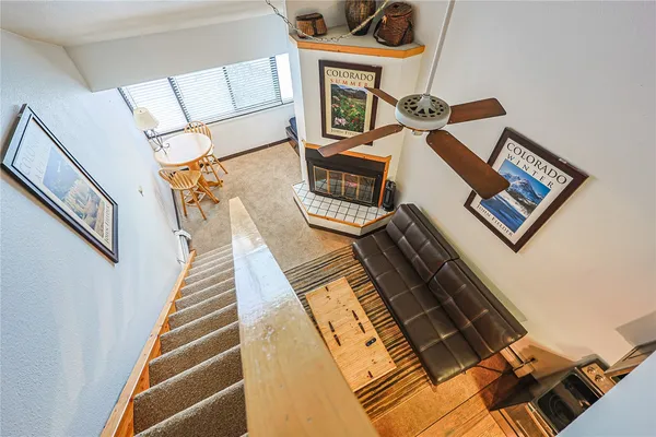 a view of an entryway and hall with wooden floor