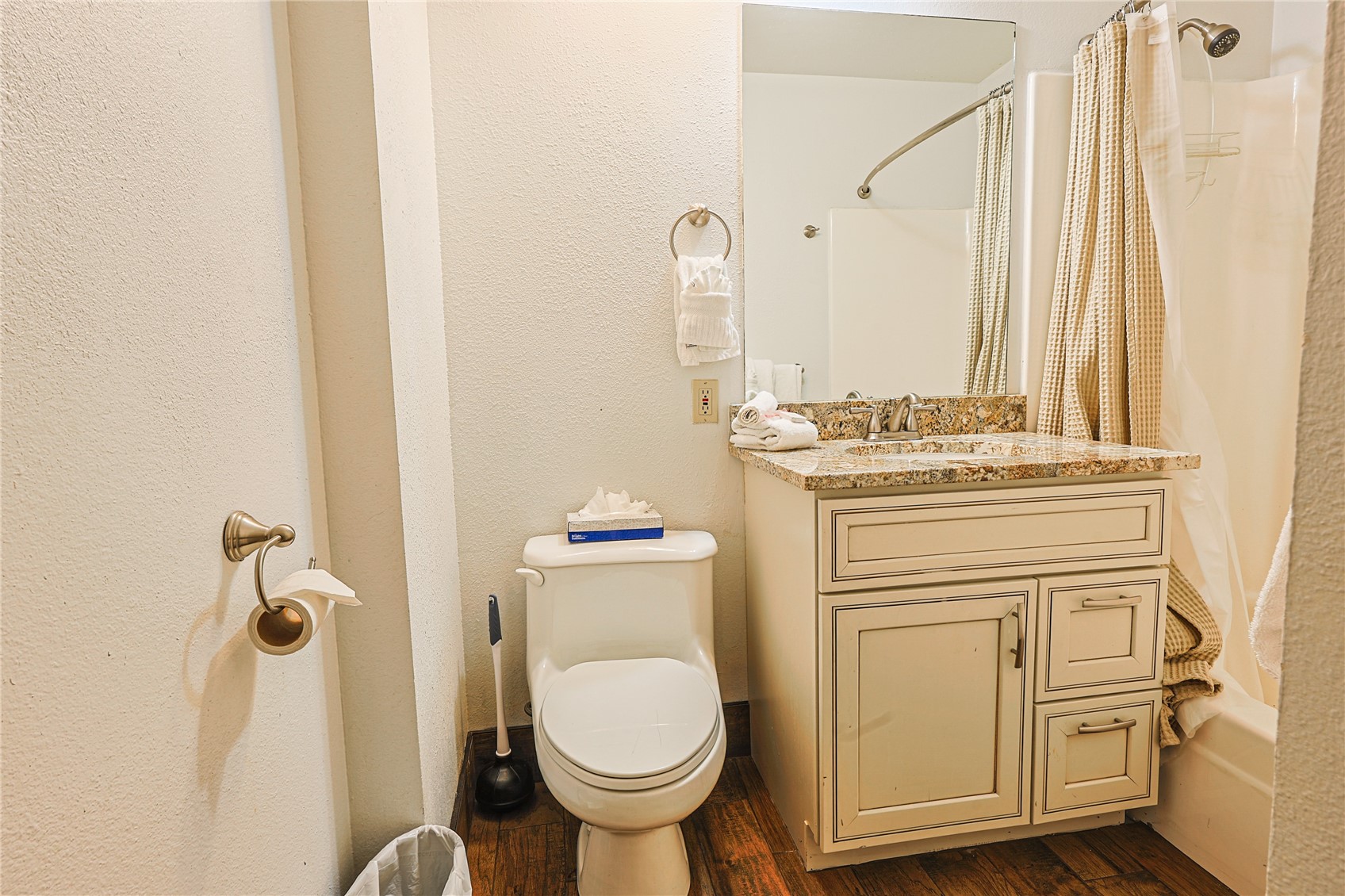 214 Ten Mile Circle, Unit R310 Copper Mountain, CO 80443 - Photo 10 of 15 a bathroom with a granite countertop toilet sink and mirror