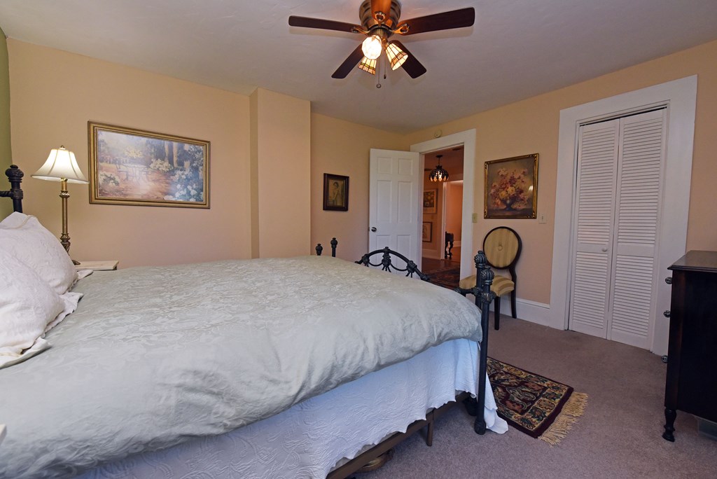 63 Loving Road Morganton, GA 30560 - Photo 42 of 58 a bedroom with a bed a table and chair