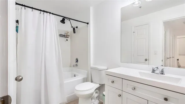 a bathroom with a sink toilet a shower and a mirror