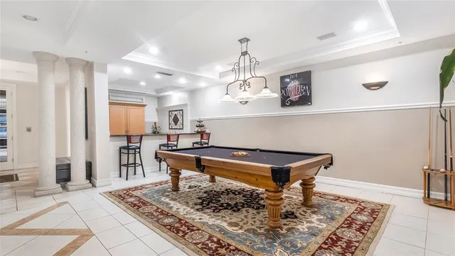 a room with lots of wooden furniture and a rug