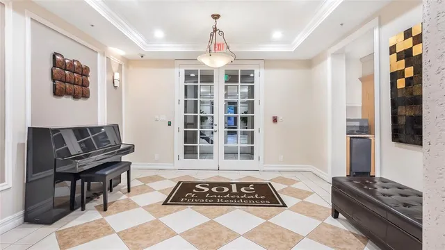 a view of a livingroom with wooden floor and workspace