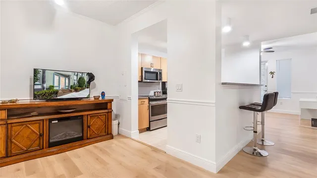 a kitchen with a stove and a refrigerator