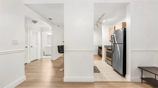 a view of a kitchen from the hallway