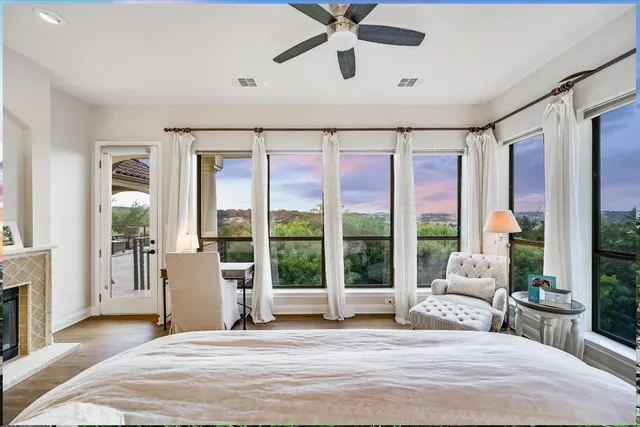 a bed room with a bed and a large window