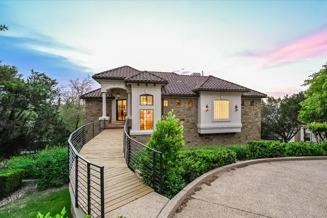 a front view of a house with yard