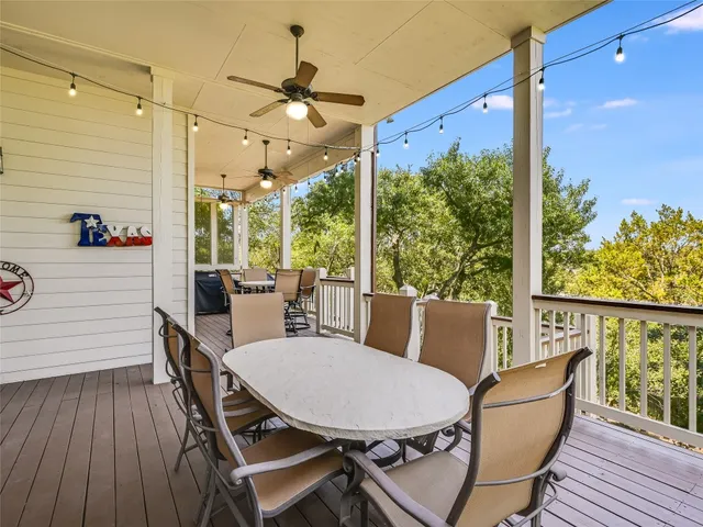 a balcony view with a seating space