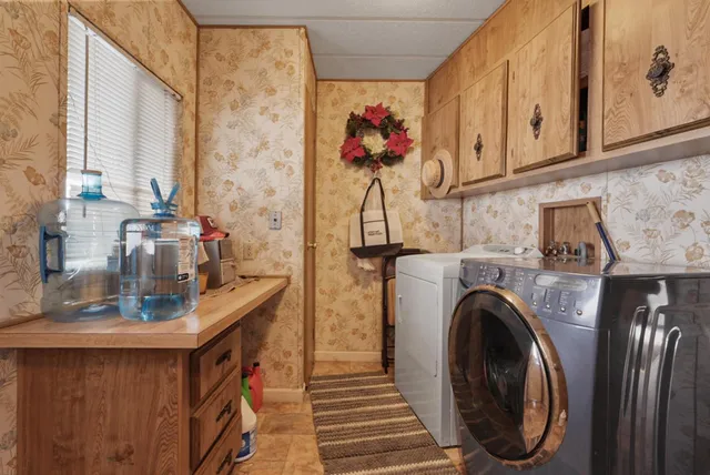 a bathroom with a granite countertop toilet and sink