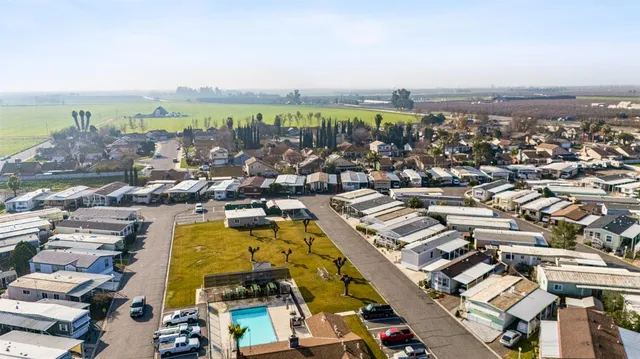 an aerial view of residential building and ocean