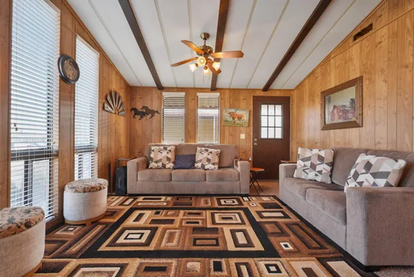 a living room with furniture and a rug