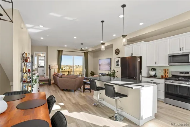 a living room with fireplace furniture and a flat screen tv