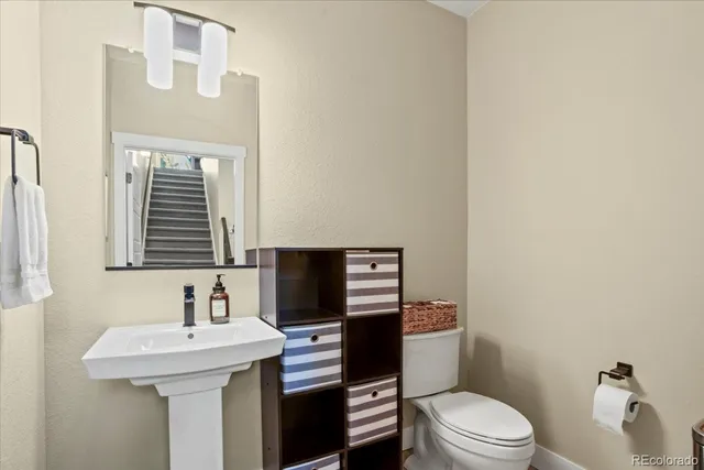 a kitchen with kitchen island a sink stove and refrigerator