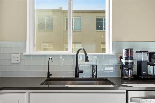 a kitchen with a sink and a window