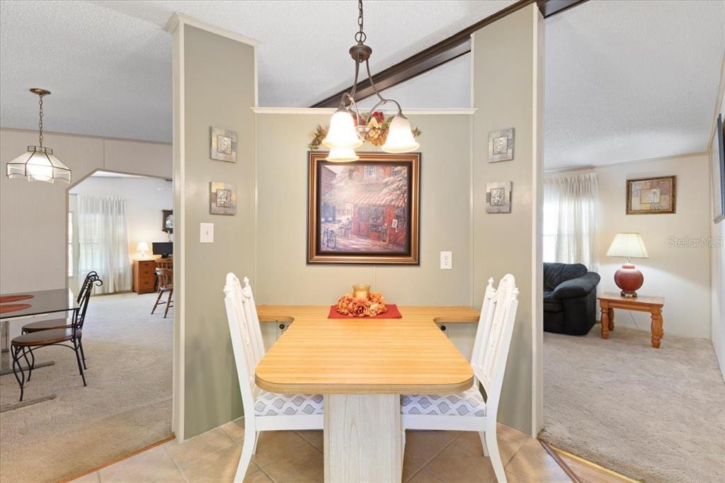 8308 Princess Court Palmetto, FL 34221 - Photo 11 of 23 a view of a dining room with furniture