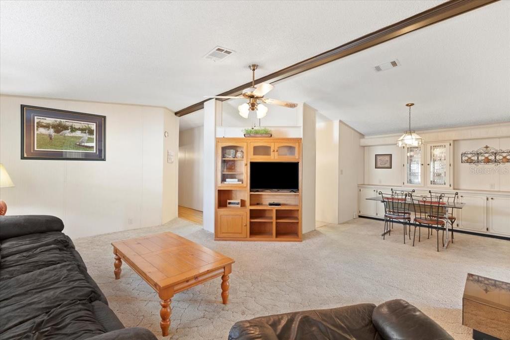 8308 Princess Court Palmetto, FL 34221 - Photo 6 of 23 a living room with furniture and a flat screen tv