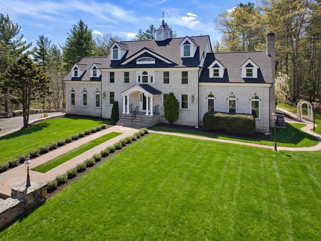 175 Pleasant Street Upton, MA 01568 - Photo 35 of 39 a front view of a house with a yard and trees