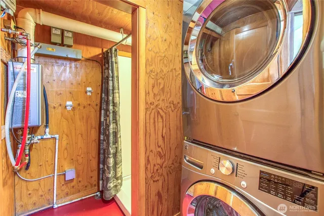 a view of a yard with plants and trees