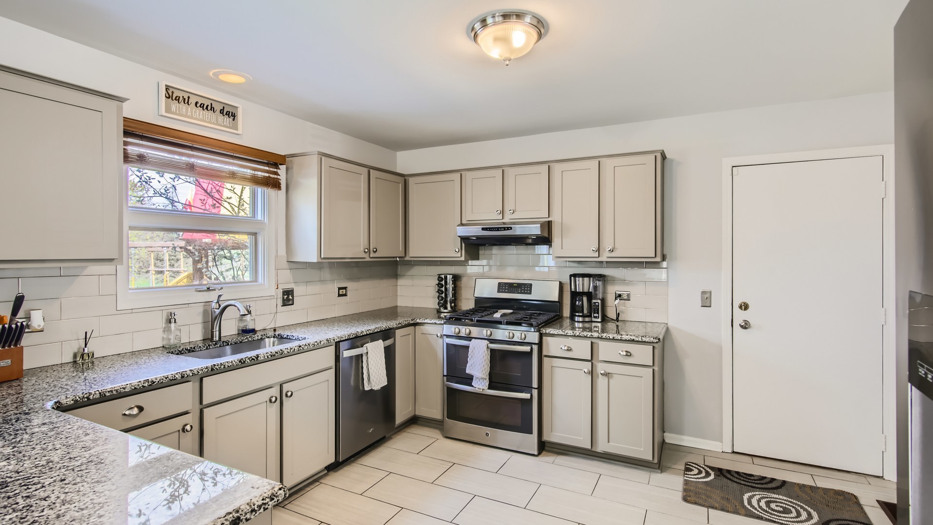 269 Concord Square Gurnee, IL 60031 - Photo 13 of 28 a kitchen with a sink stove top oven and cabinets
