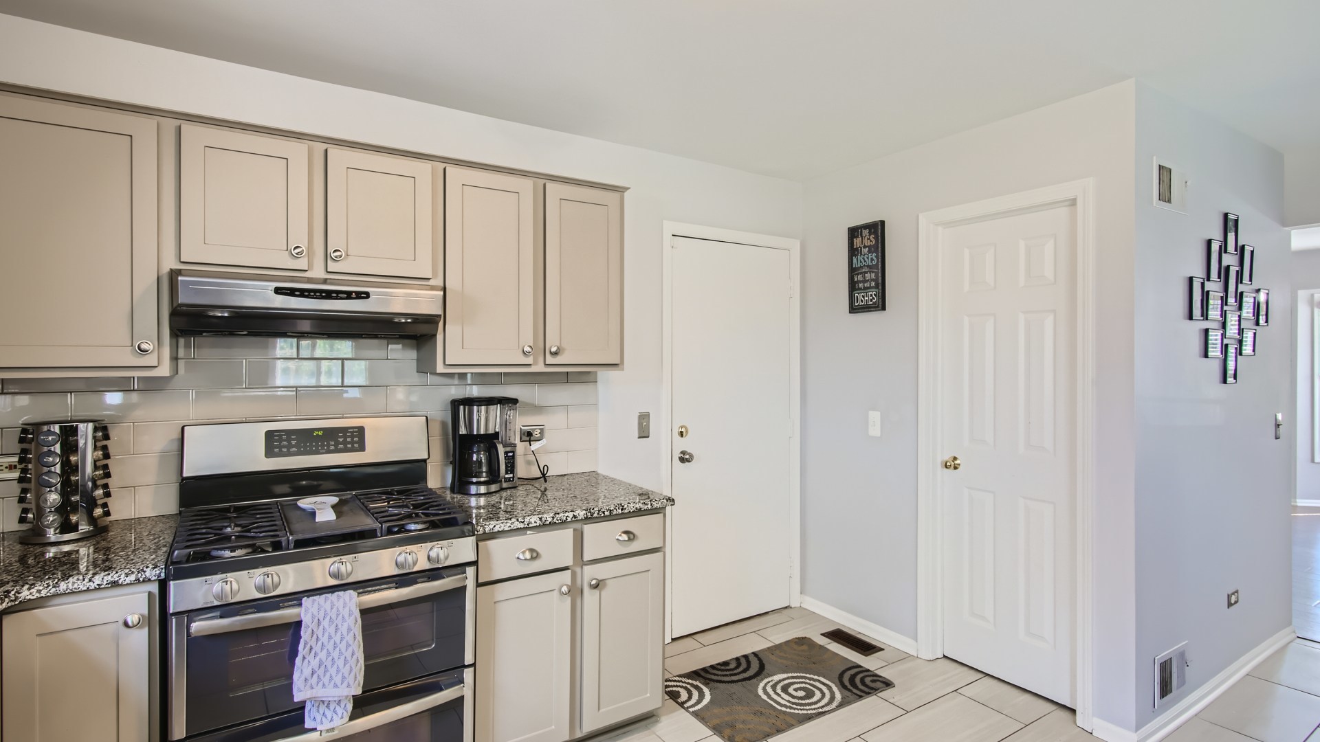 269 Concord Square Gurnee, IL 60031 - Photo 15 of 28 a kitchen with stainless steel appliances granite countertop a stove and a refrigerator