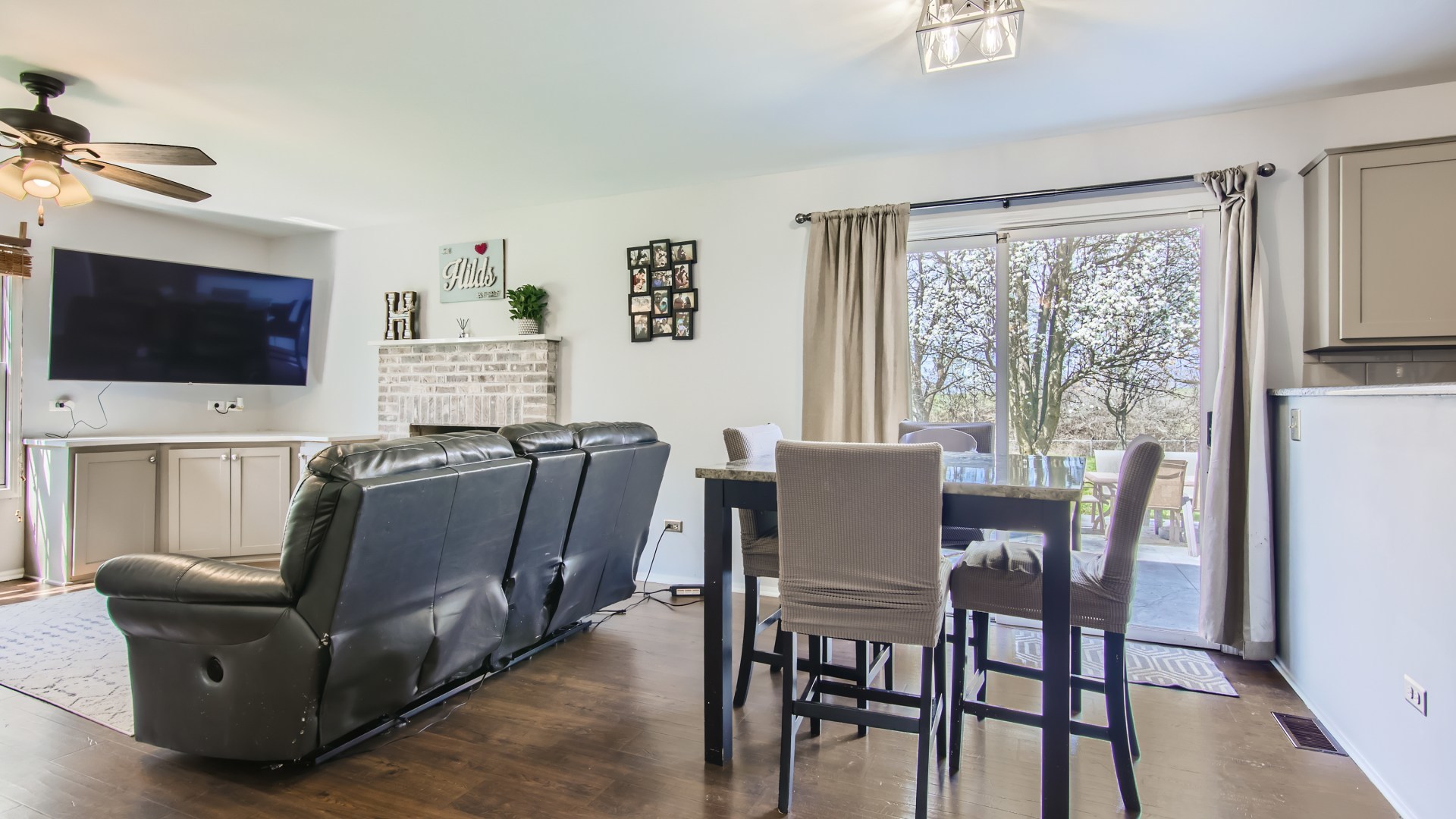 269 Concord Square Gurnee, IL 60031 - Photo 16 of 28 a living room with furniture a flat screen tv and a large window