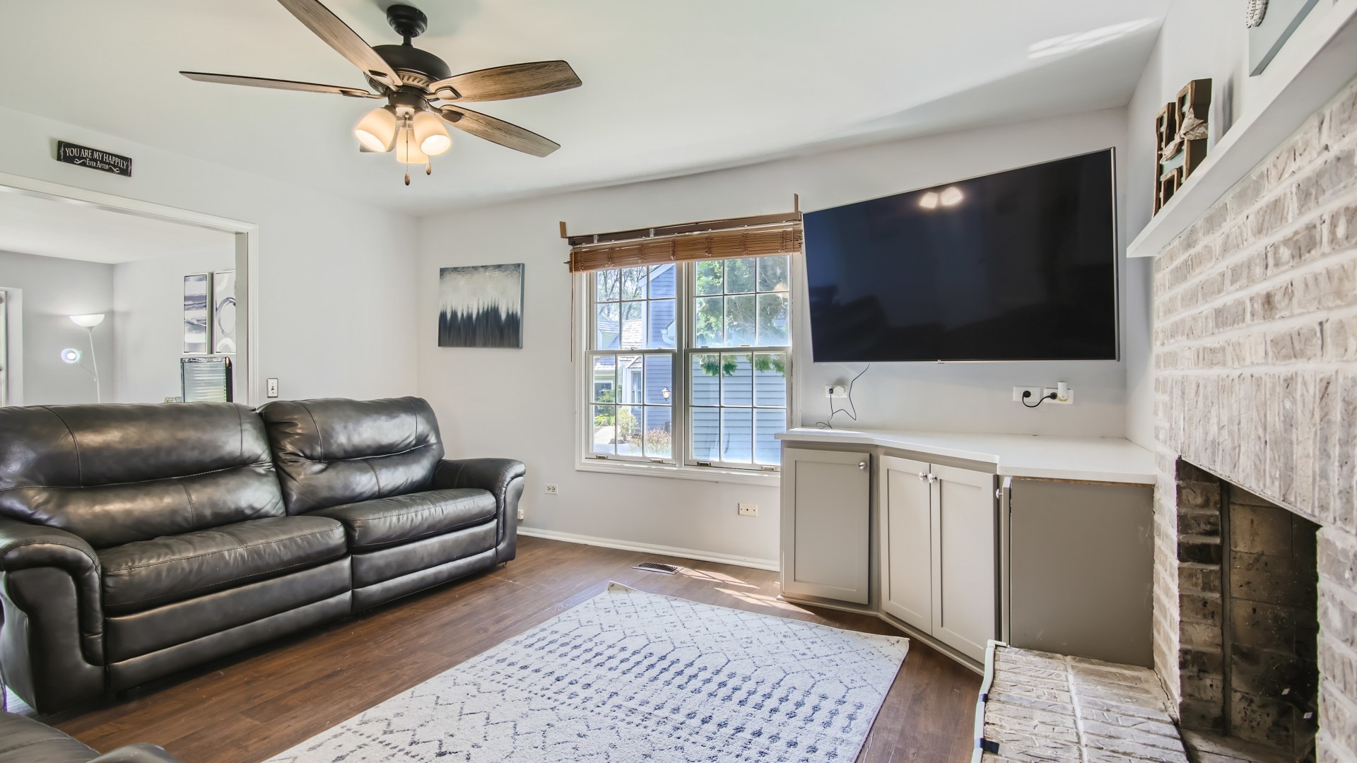 269 Concord Square Gurnee, IL 60031 - Photo 18 of 28 a living room with furniture a flat screen tv and a fireplace