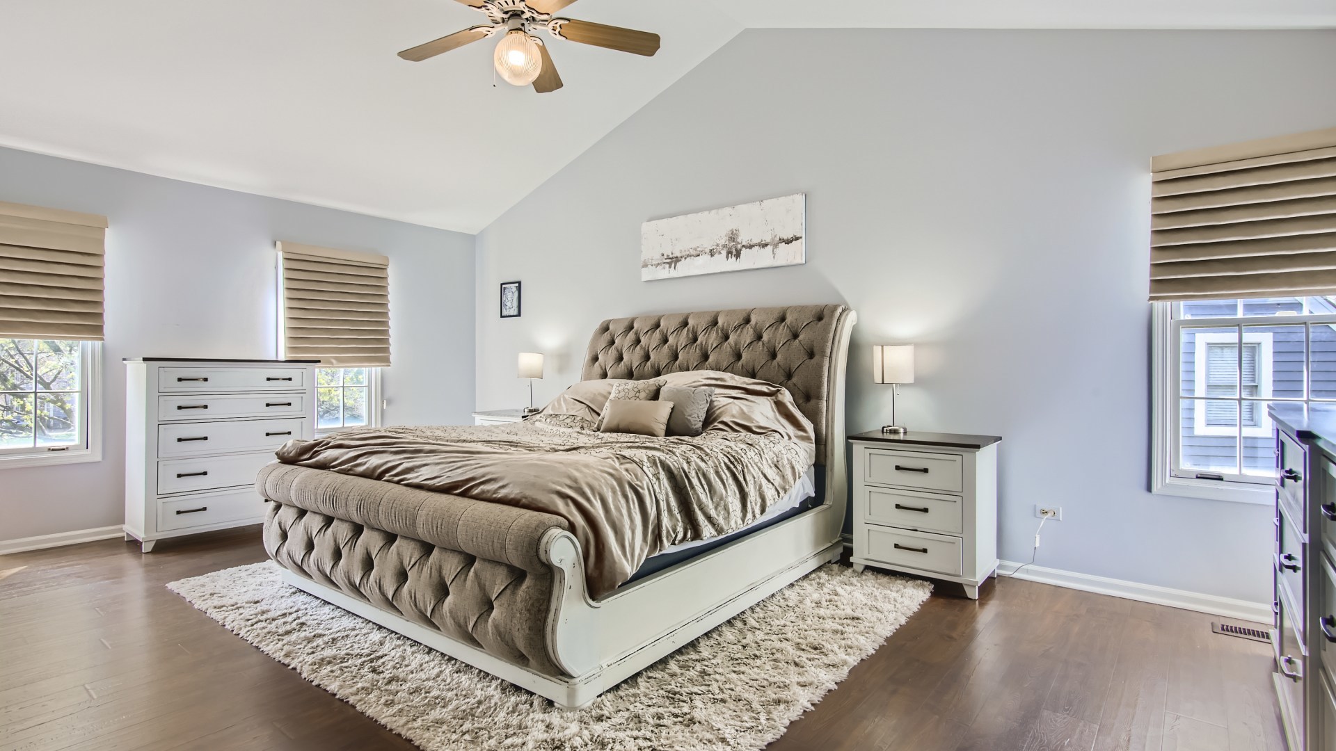 269 Concord Square Gurnee, IL 60031 - Photo 19 of 28 a bedroom with a bed a chandelier and a window