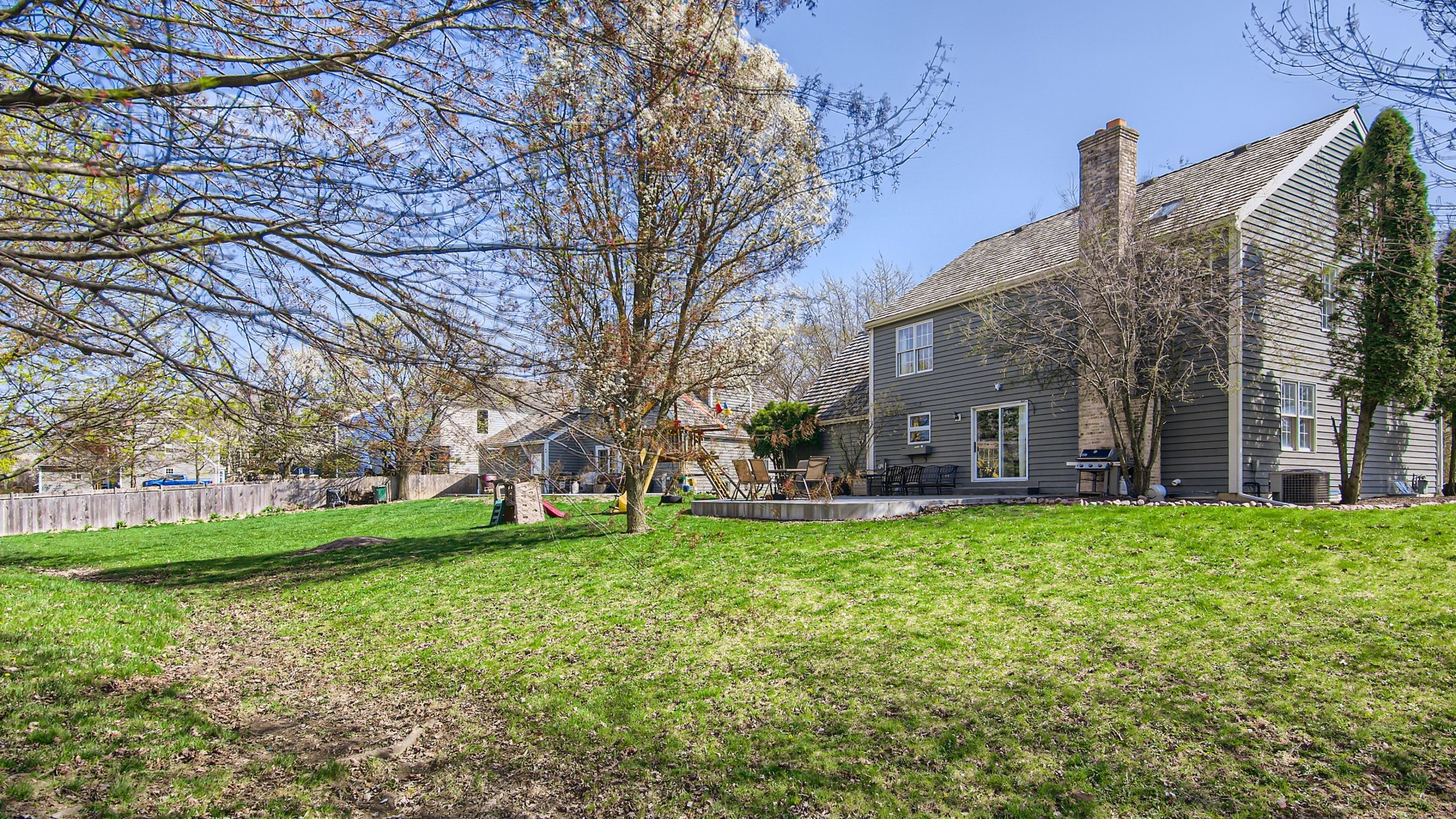 269 Concord Square Gurnee, IL 60031 - Photo 6 of 28 a view of a house with a big yard and large trees