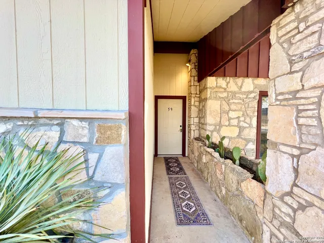 a view of a balcony with wooden floor