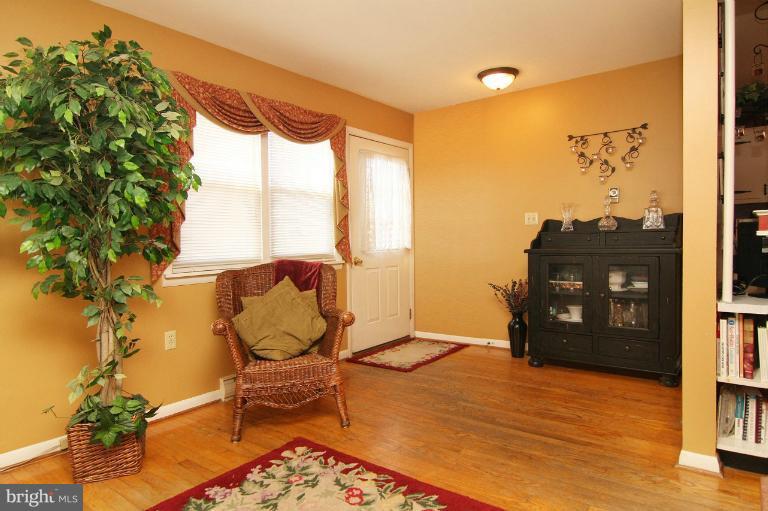 245 Stem Road Union Bridge, MD 21791 - Photo 12 of 26 a view of a balcony with furniture and floor to ceiling window