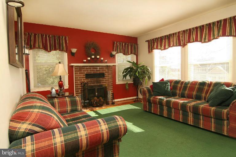245 Stem Road Union Bridge, MD 21791 - Photo 13 of 26 a living room with furniture a fireplace and a large window