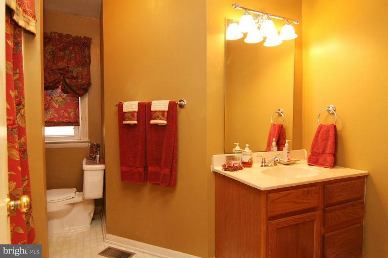 245 Stem Road Union Bridge, MD 21791 - Photo 22 of 26 a bathroom with a sink vanity and a mirror