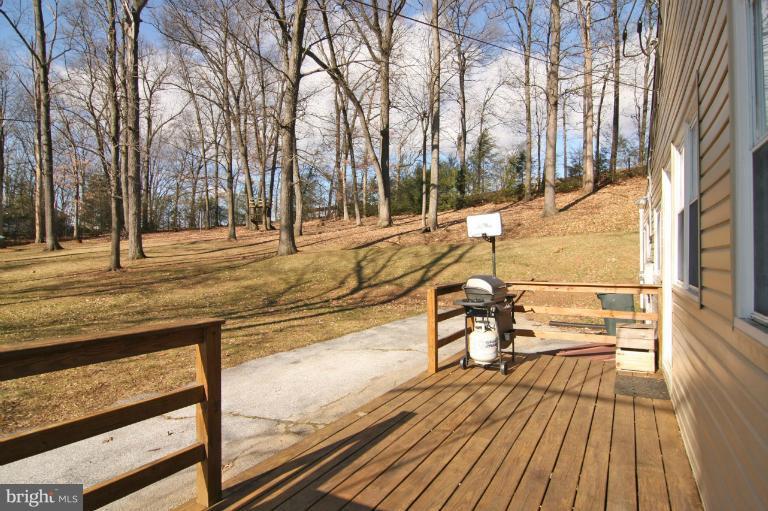 245 Stem Road Union Bridge, MD 21791 - Photo 23 of 26 a view of a balcony with wooden floor and outdoor seating