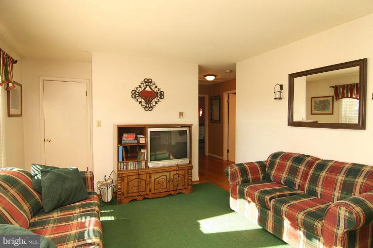 245 Stem Road Union Bridge, MD 21791 - Photo 26 of 26 a living room with furniture and a flat screen tv