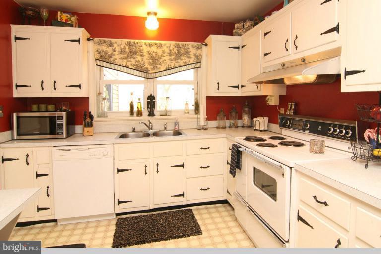 245 Stem Road Union Bridge, MD 21791 - Photo 4 of 26 a kitchen with stainless steel appliances kitchen island granite countertop a sink and cabinets