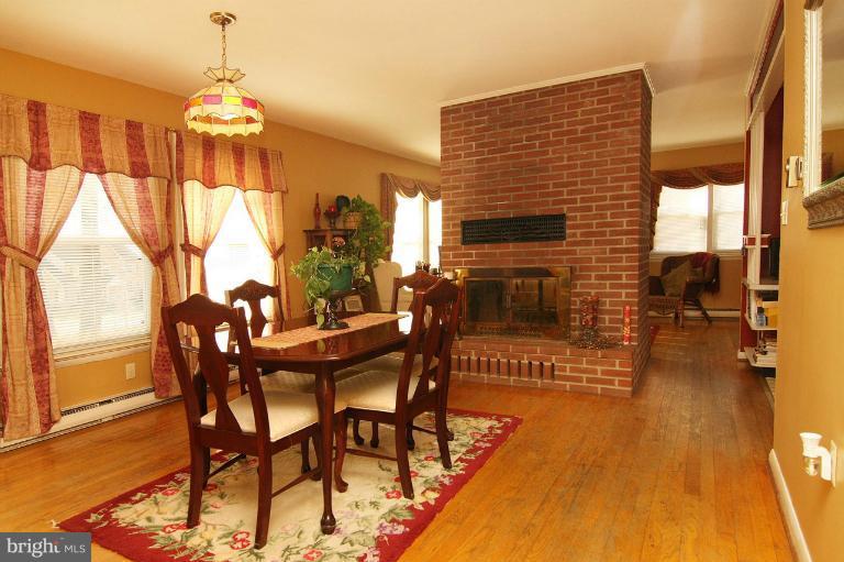 245 Stem Road Union Bridge, MD 21791 - Photo 8 of 26 a dining room with furniture window and wooden floor