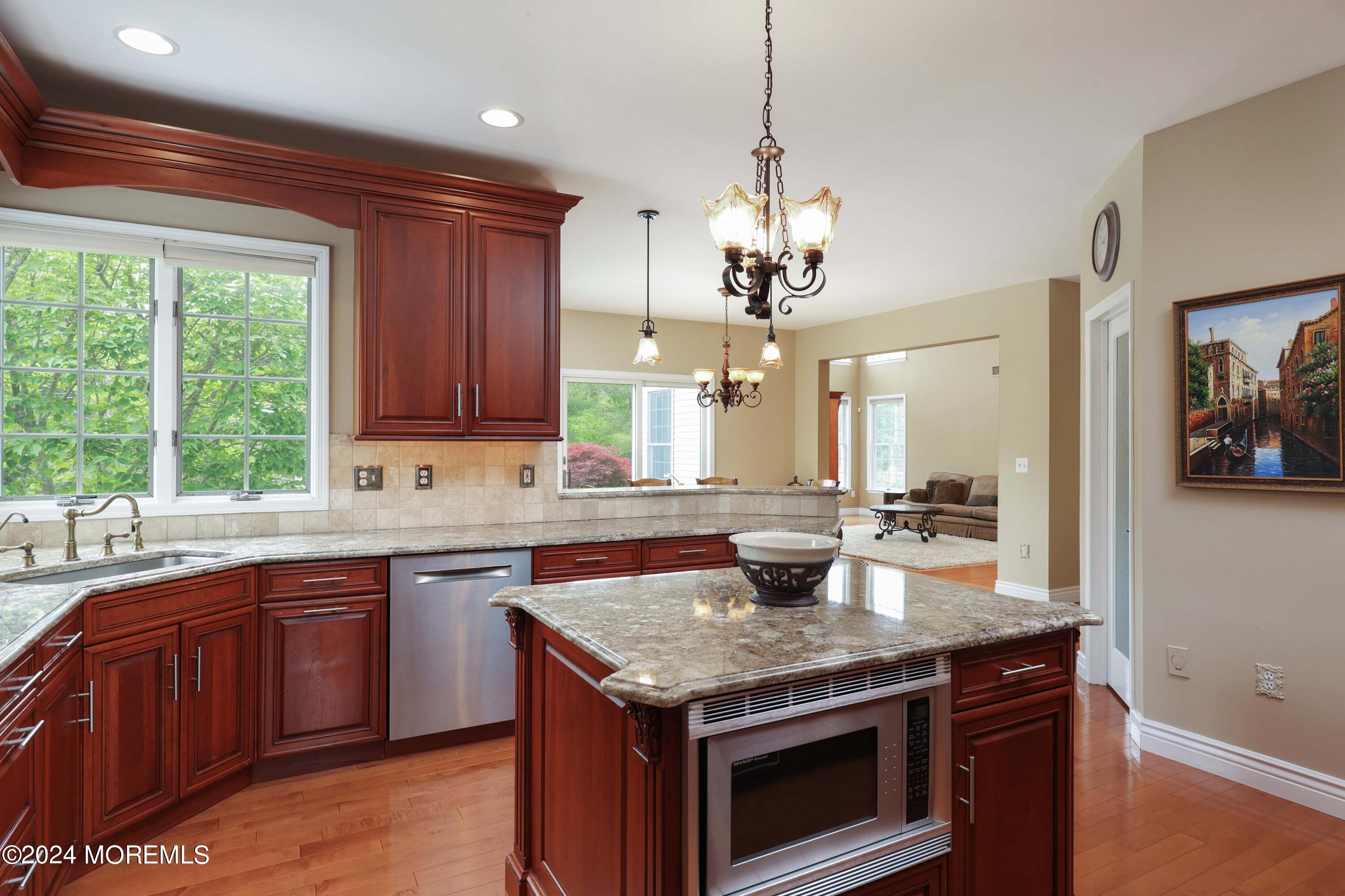 12 Shadowbrook Drive Colts Neck, NJ 07722 - Photo 13 of 33 a kitchen with a stove sink and cabinets