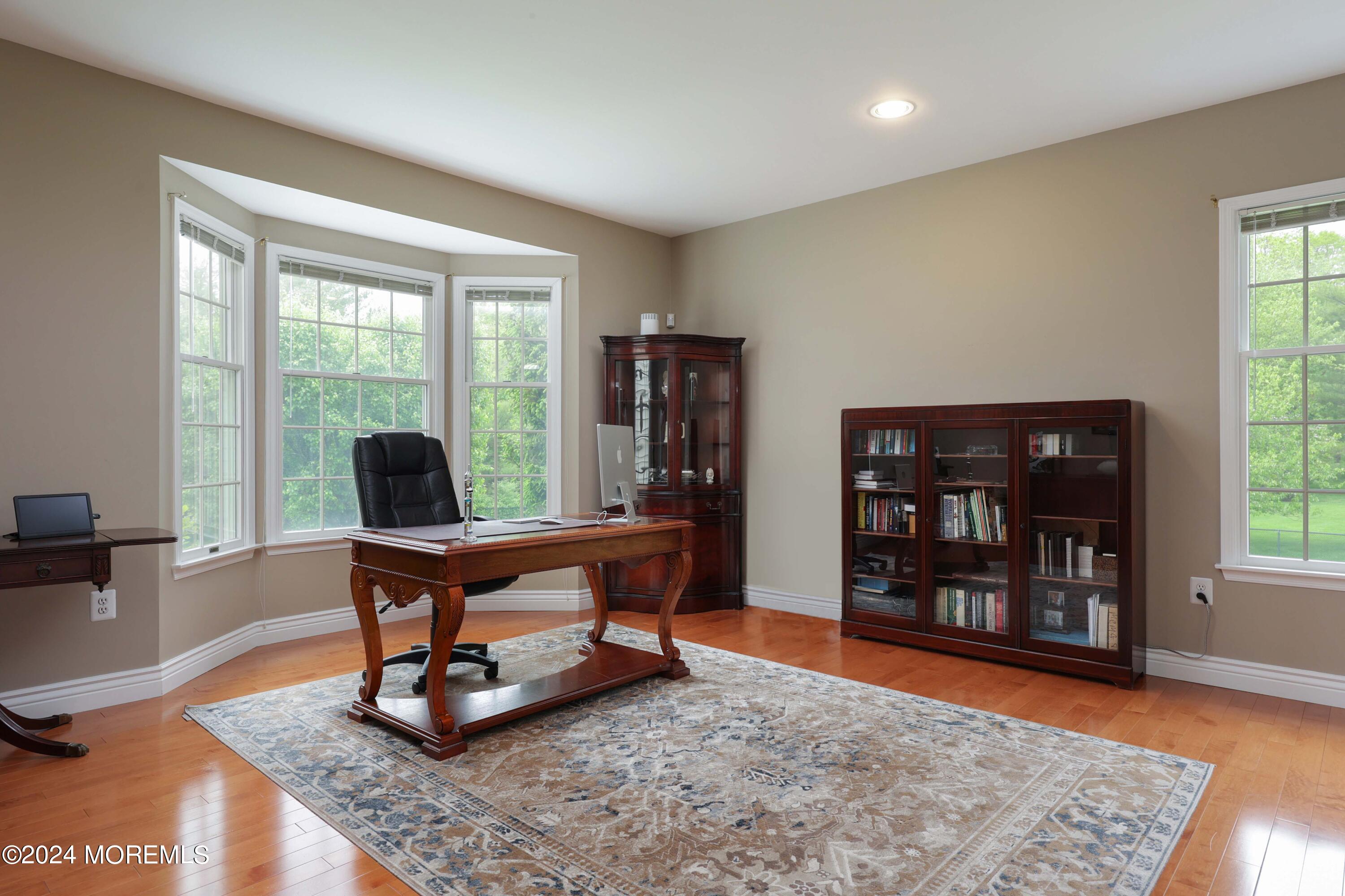 12 Shadowbrook Drive Colts Neck, NJ 07722 - Photo 14 of 33 a living room with furniture and a wooden floor