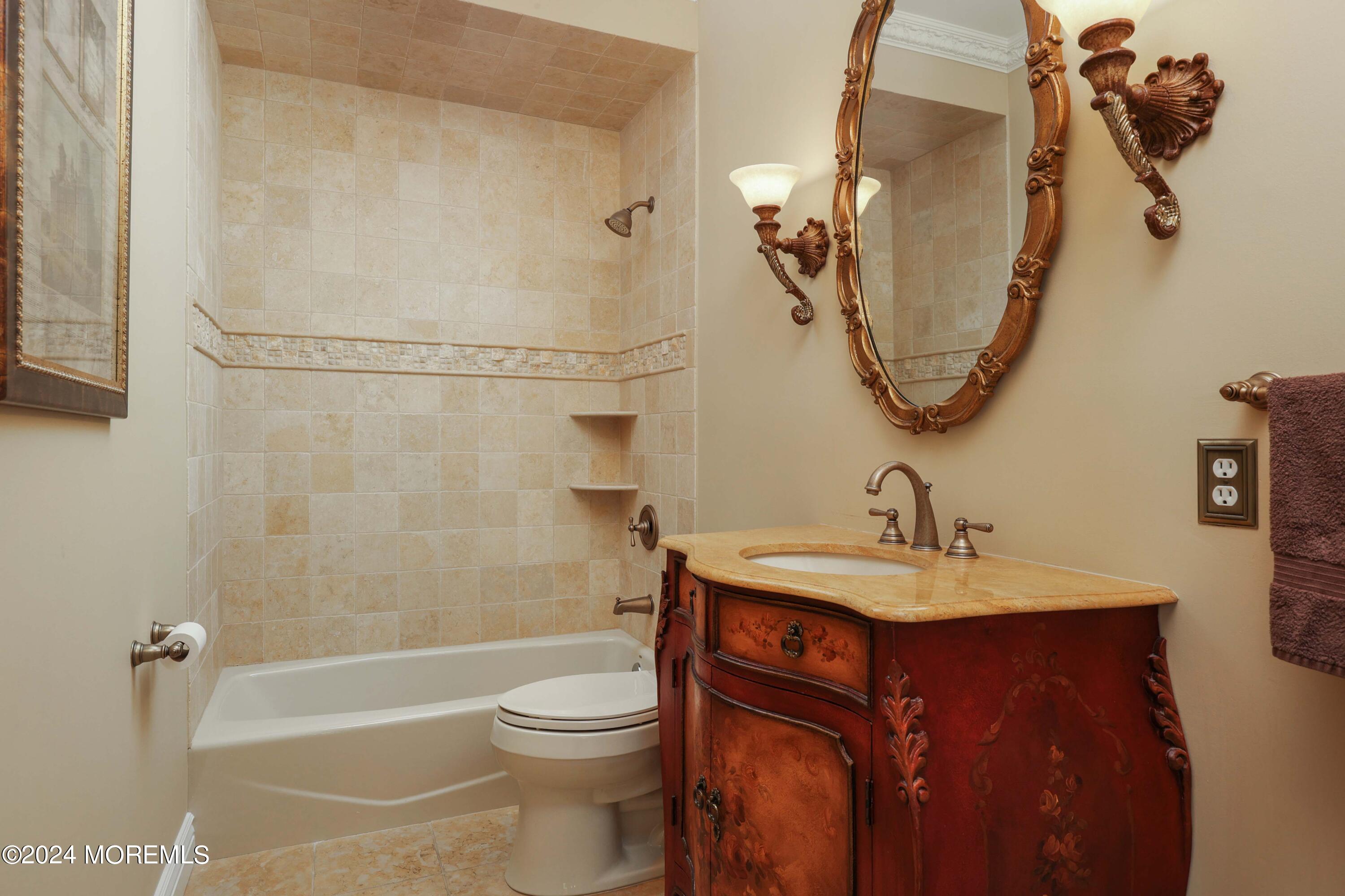 12 Shadowbrook Drive Colts Neck, NJ 07722 - Photo 15 of 33 a bathroom with a sink a toilet and a mirror