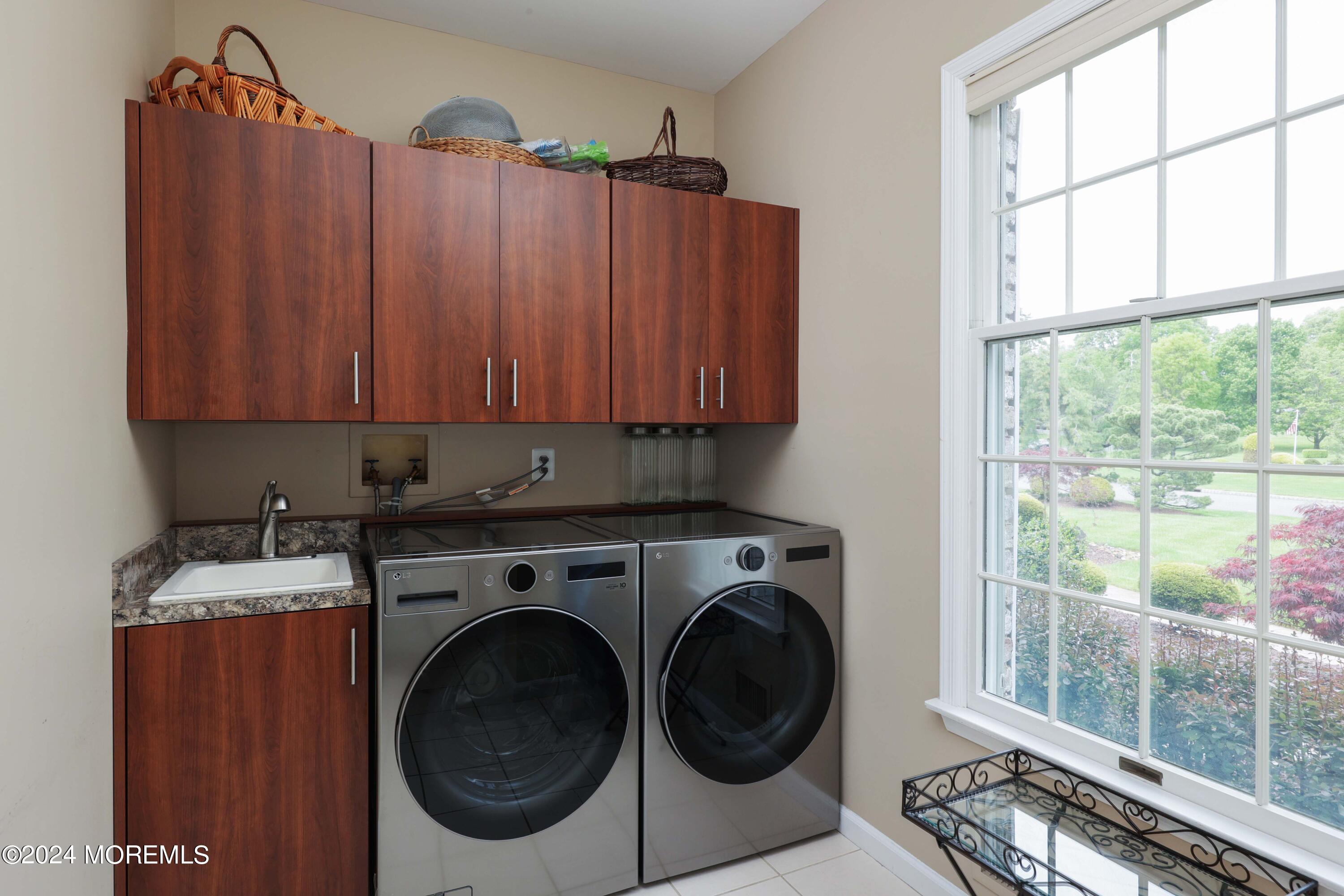 12 Shadowbrook Drive Colts Neck, NJ 07722 - Photo 16 of 33 a utility room with dryer and washer