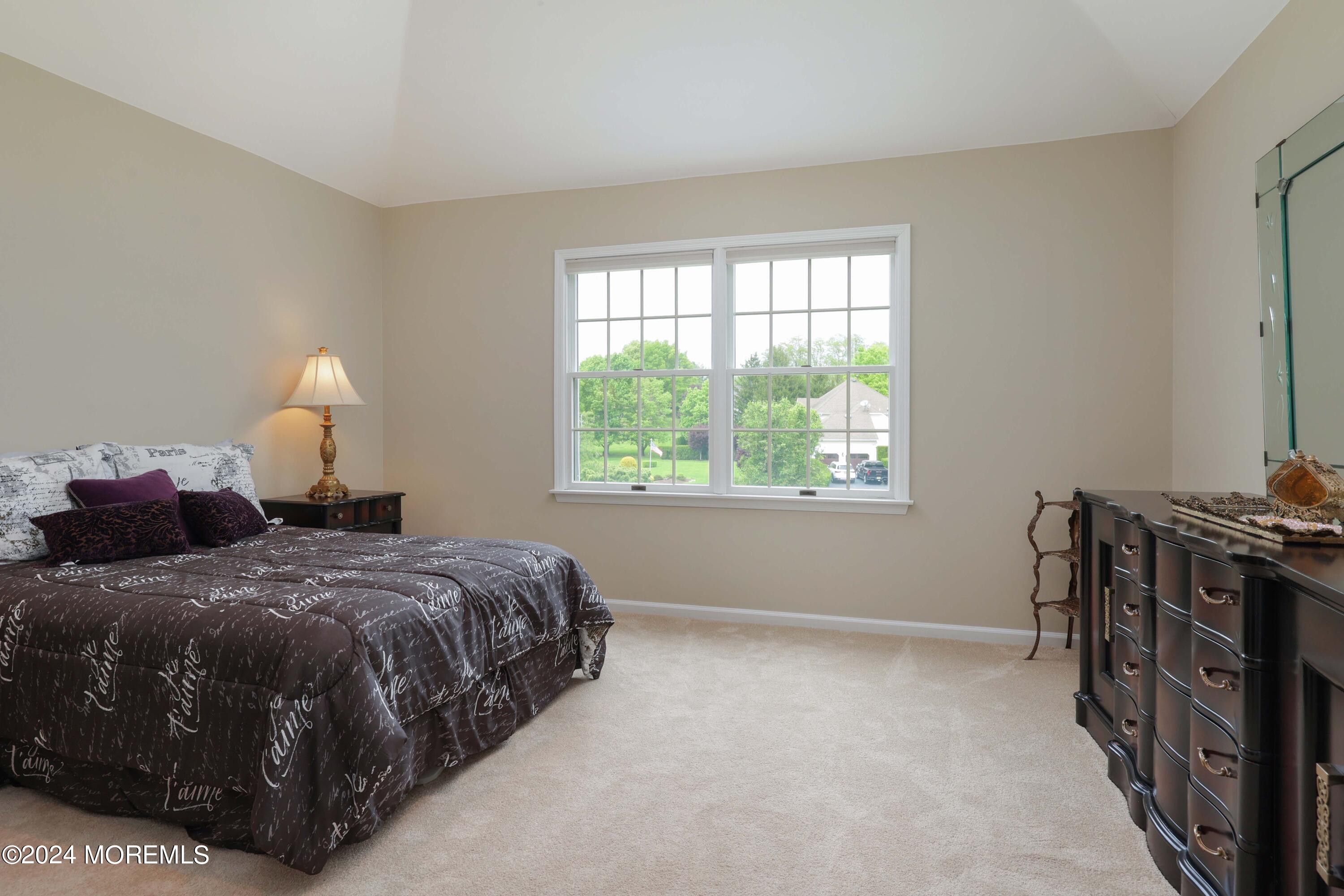 12 Shadowbrook Drive Colts Neck, NJ 07722 - Photo 19 of 33 a bedroom with a bed and a window