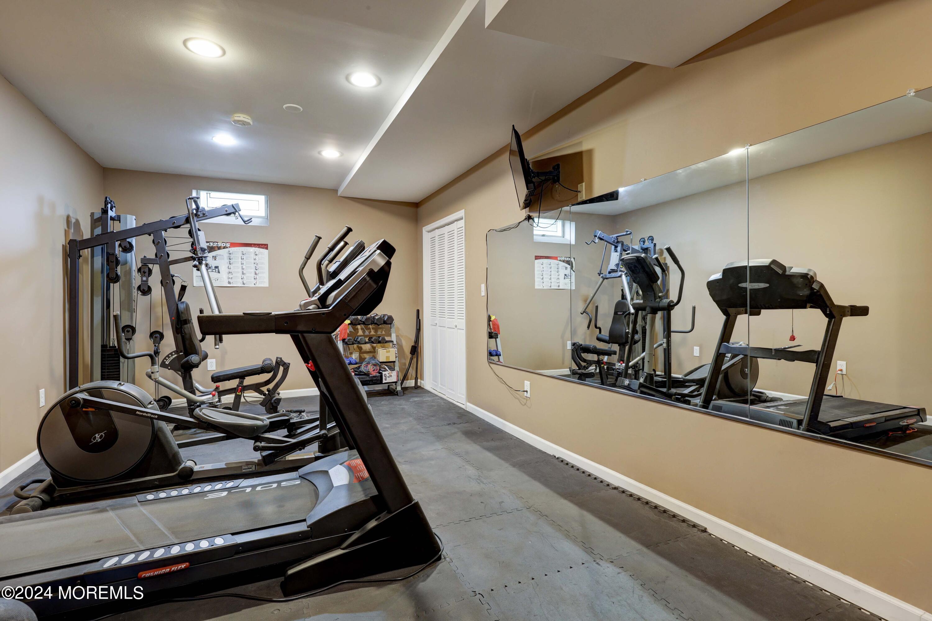 12 Shadowbrook Drive Colts Neck, NJ 07722 - Photo 24 of 33 a view of a room with gym equipment