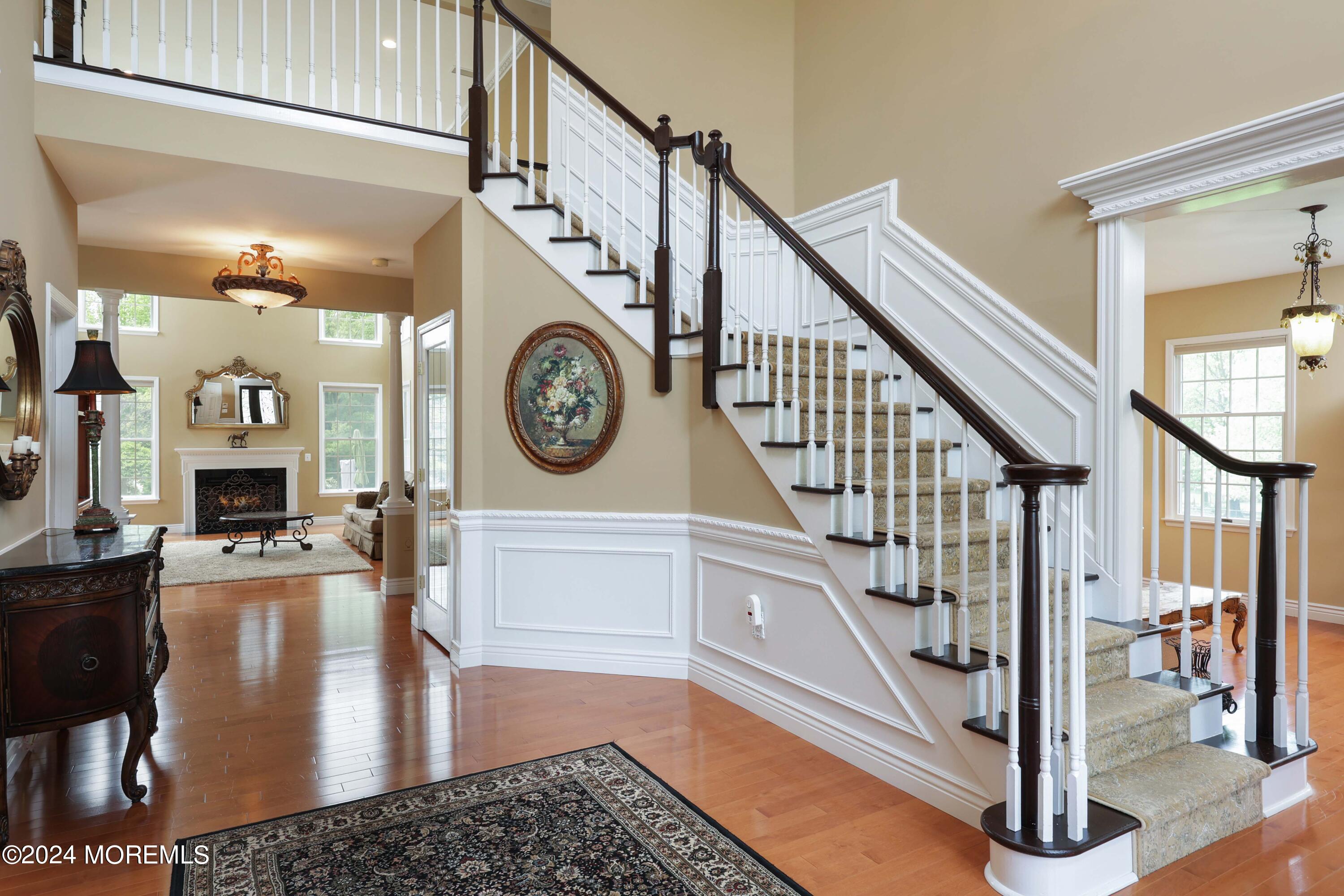 12 Shadowbrook Drive Colts Neck, NJ 07722 - Photo 3 of 33 a view of entryway and hall with wooden floor