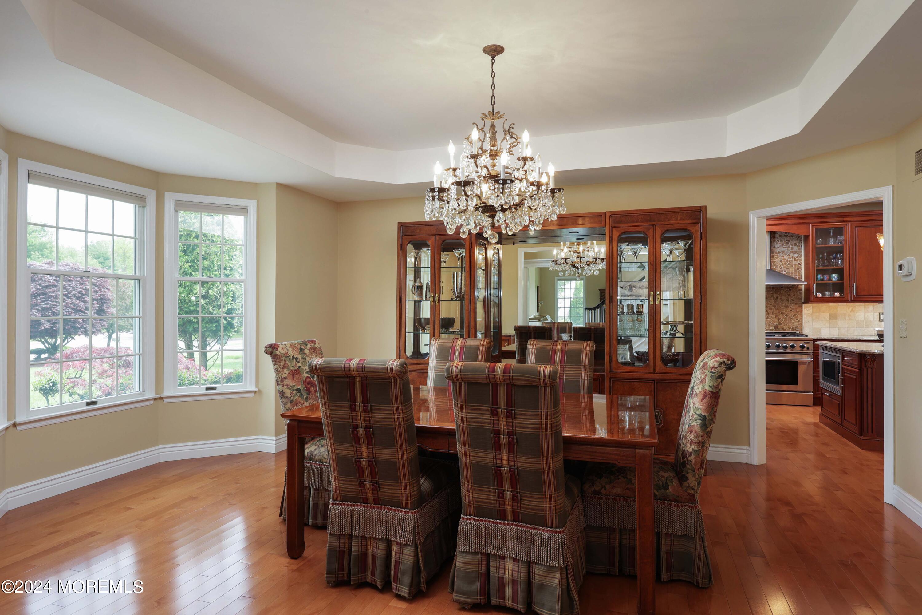 12 Shadowbrook Drive Colts Neck, NJ 07722 - Photo 6 of 33 a view of a dining room with furniture window and wooden floor