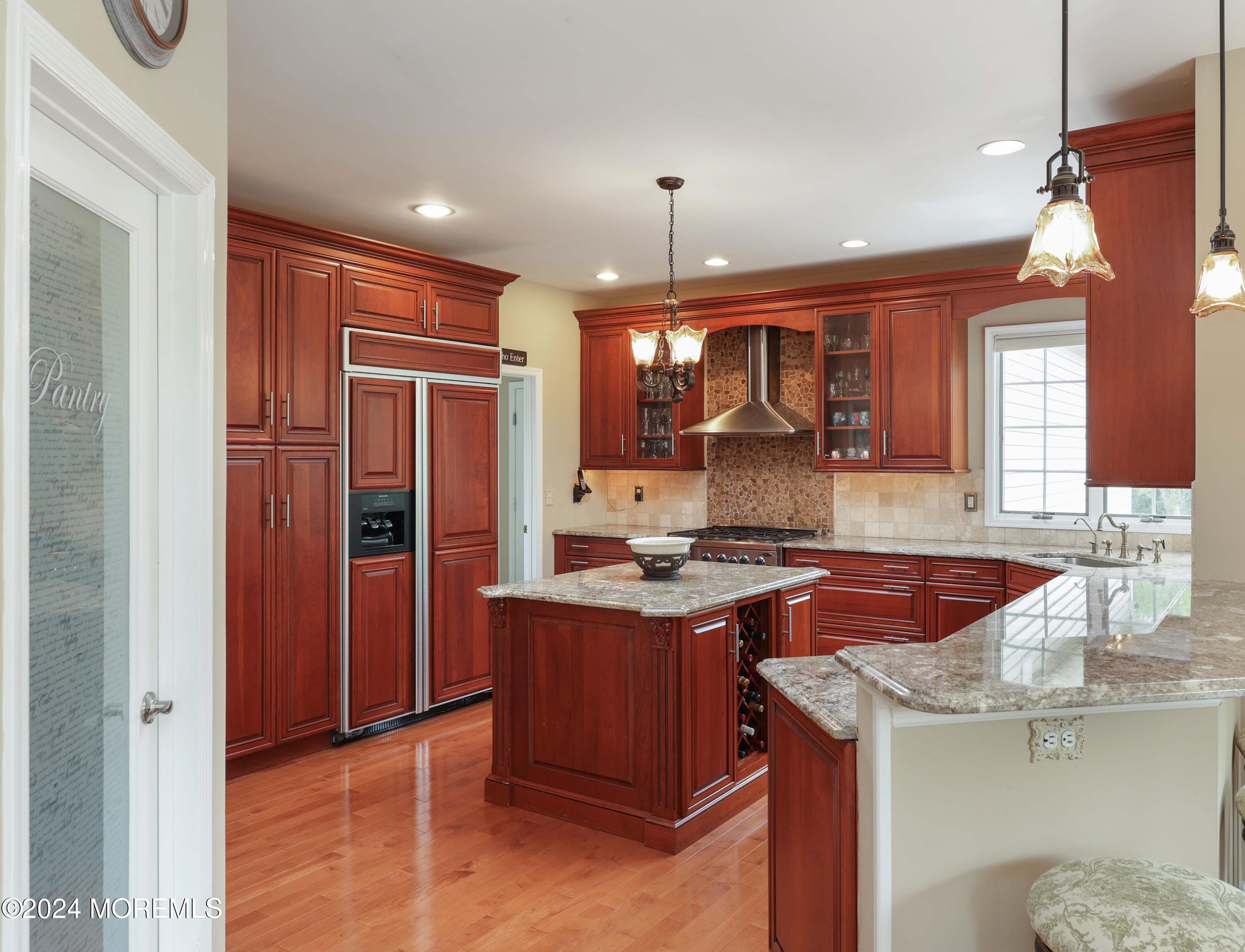 12 Shadowbrook Drive Colts Neck, NJ 07722 - Photo 9 of 33 a kitchen with stainless steel appliances granite countertop a sink stove and refrigerator