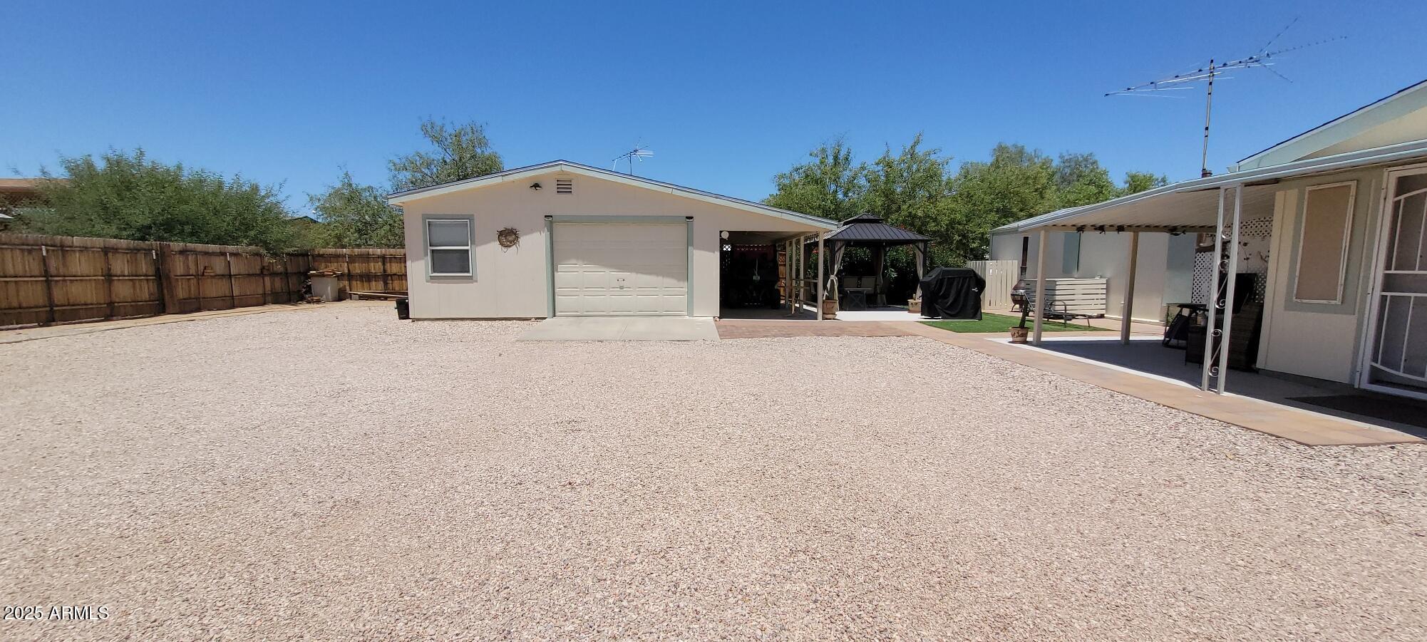 30850 South Vagabond Trail, Unit 87 Congress, AZ 85332 - Photo 16 of 19 a front view of a house with a yard